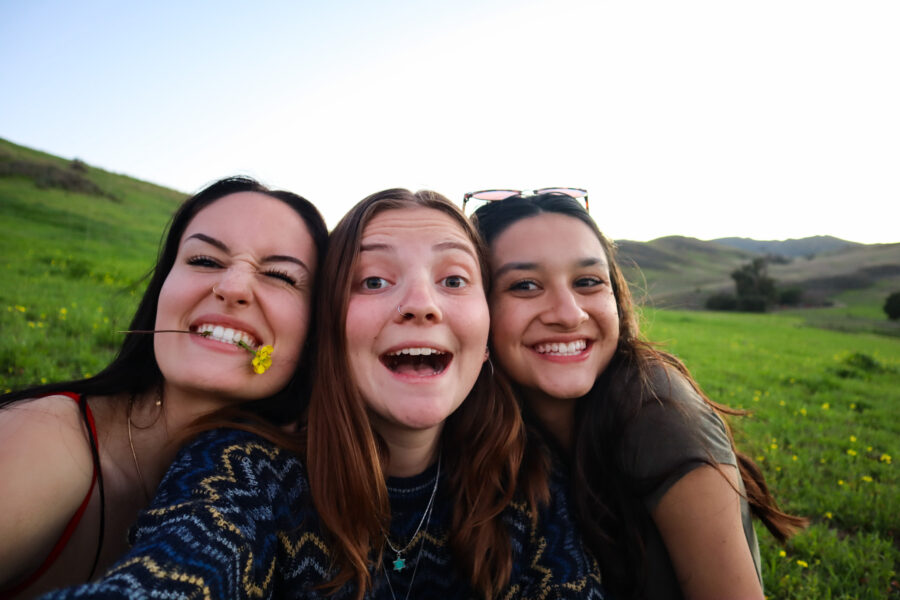 smiling girls taking a selfie.